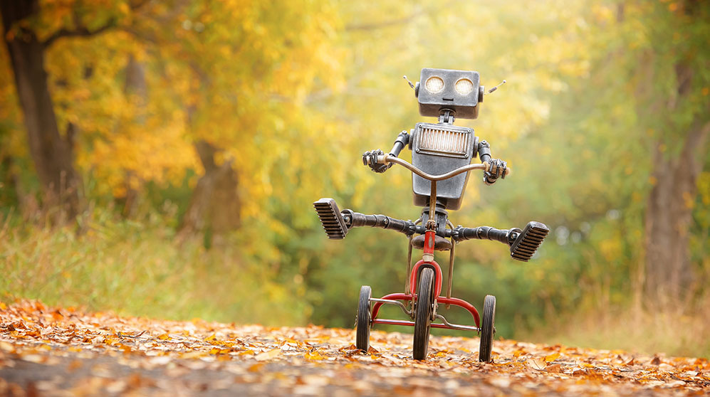 Photo of a happy AI robot riding a bike